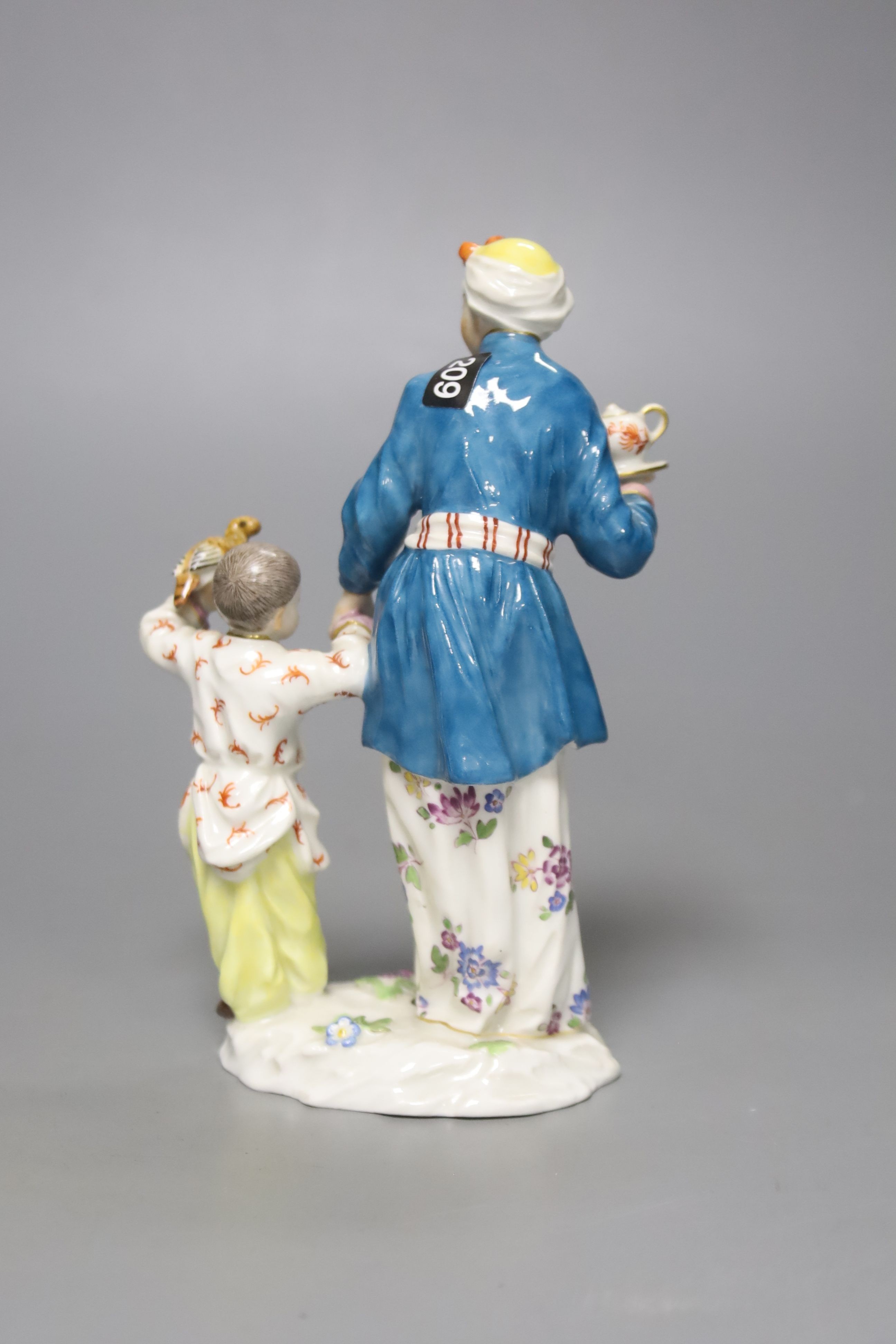 A Meissen group of a Chinese lady and a boy, 20th century, height 14cm